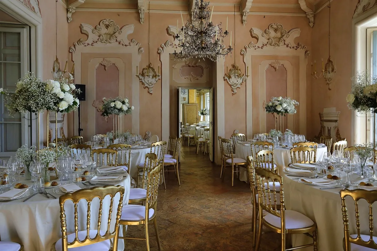 A luxurious dining room with elegant decor and table settings, perfect for a special event.